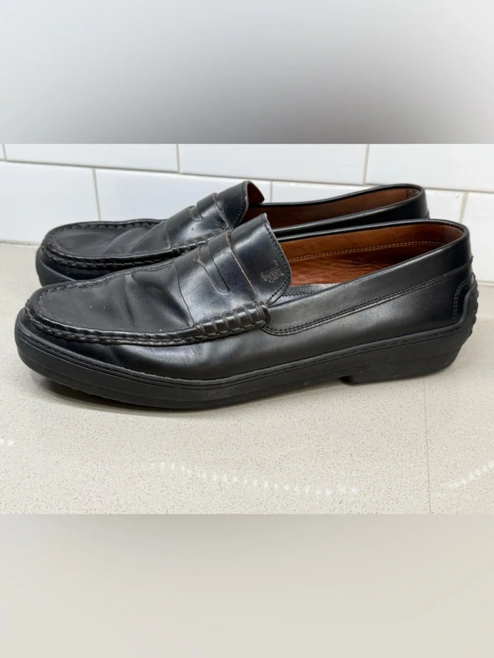 Tod's Black Leather Penny Loafers for Men